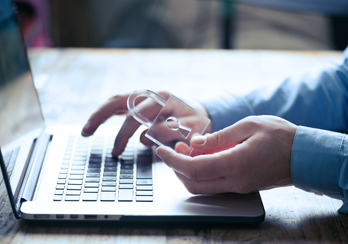 A computer user holding a transparent lock 