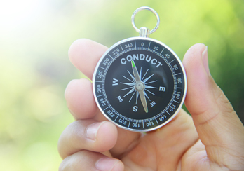 A person holding a compass