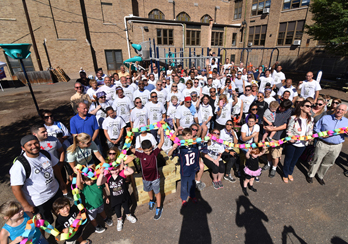 Large group of children pose for a group photo