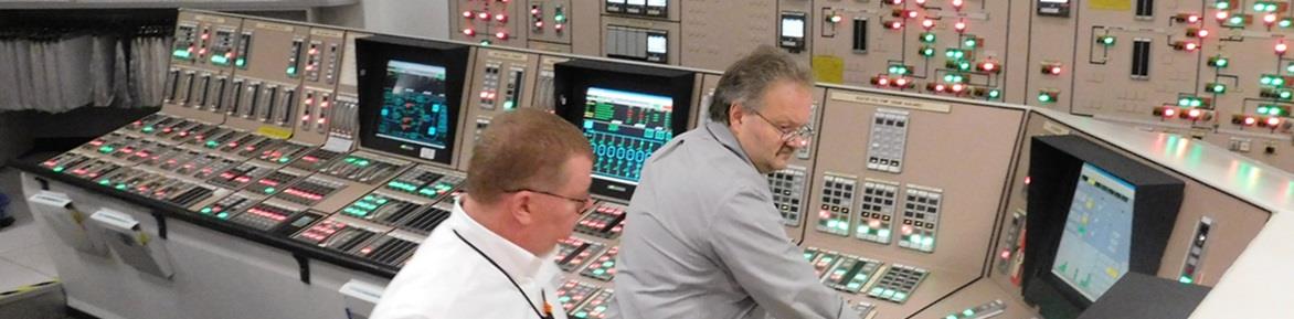 PSEG Power operators managing a control panel.