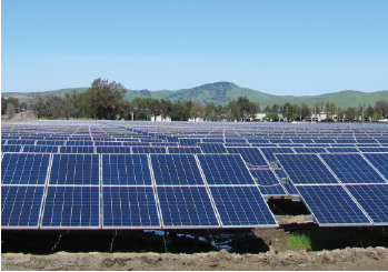 A solar farm with rows of solar panels 