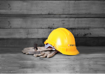 A hard hat and gloves on a job site