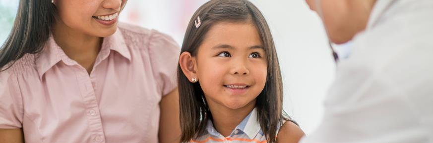 Child smiles at doctor during check up