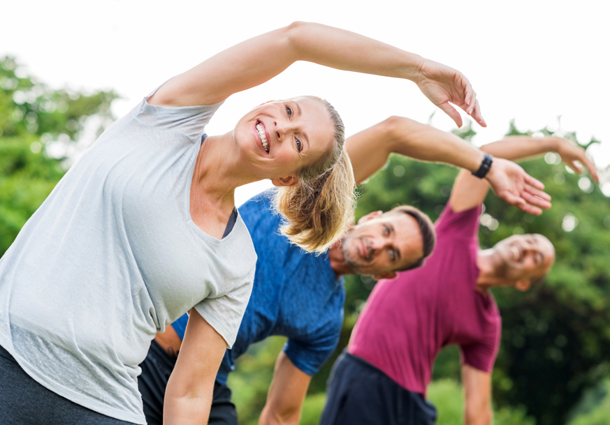 Three people enjoying yoga 