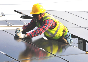 PSEG Employee performing maintenance on a Solar Panel