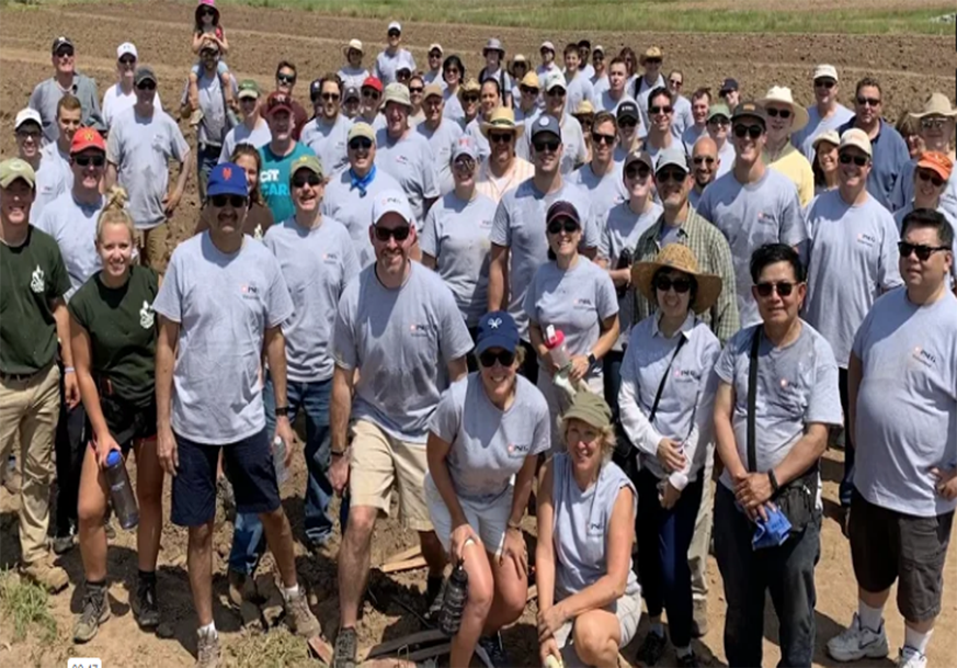 PSEG employees are shown volunteering at a farm.