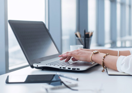 A person typing on a computer