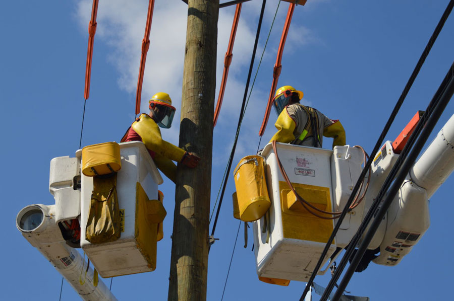 PSE&G Lineworkers are shown working in a bucket truck.