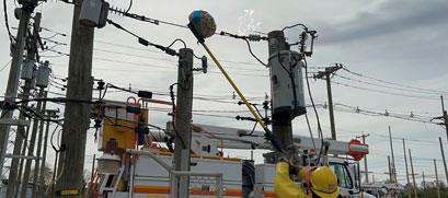 Mylar balloons are shown entangled in power lines.