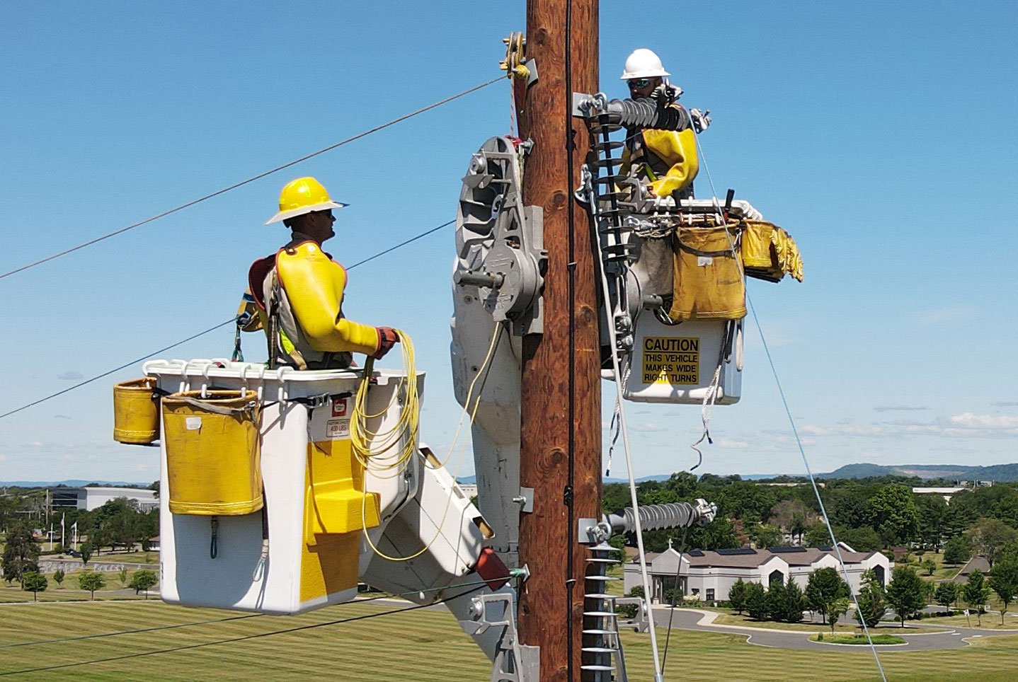 PSE&G linemen working on a utility pole are shown.